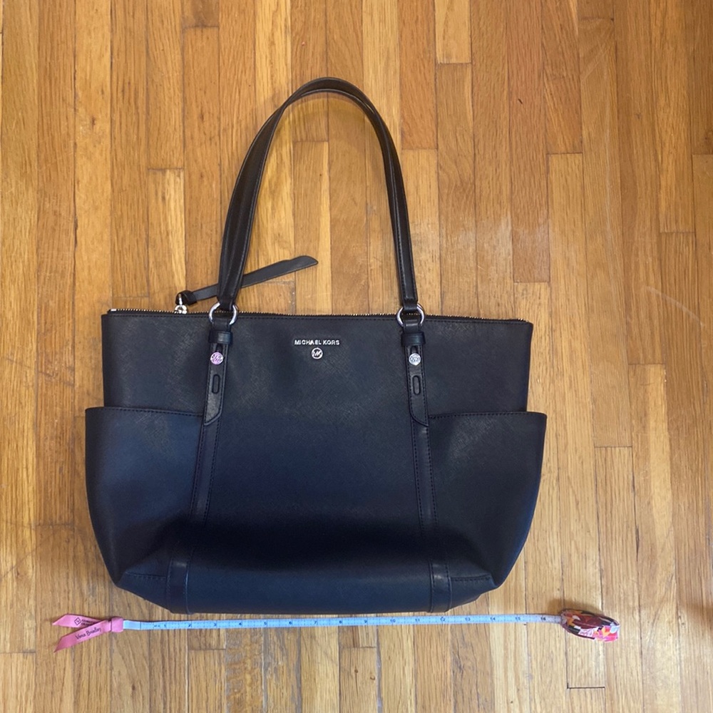 “As is” used black Michael Kors shoulder bag with dust bag.